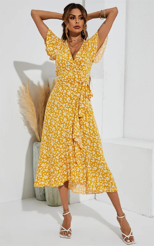 Midi dresses with ruffled bodices for a more pronounced feminine look Gelbes Midikleid mit Blumendruck und Wickelsaum Midi dresses with ruffled bodices for a more pronounced feminine look Gelbes Midikleid mit Blumendruck und Wickelsaum
