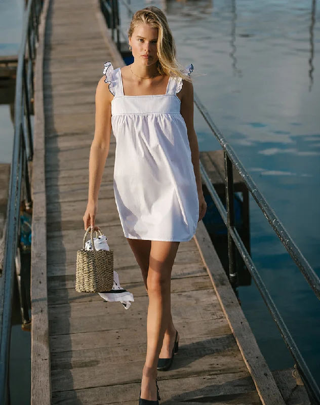 Mini dresses with tassel accents for a fun touch Sanaly Mini Dress in White with Navy Babylock