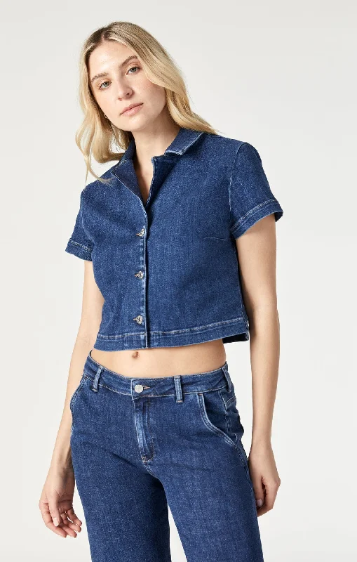 Embellished women jeans with studs or rhinestones for a glamorous touchKEYLA CROP SHORT SLEEVE SHIRT IN DARK FEATHER BLUE