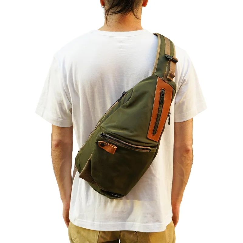 Distressed Denim Top for a Trendy and Edgy LookMaster-piece "Circus" Sling Bag