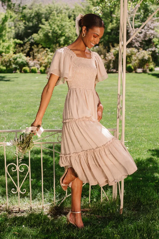 Maxi dresses with pom - pom trims for a playful and festive lookEllie Dress in Champagne Chiffon Maxi dresses with pom - pom trims for a playful and festive lookEllie Dress in Champagne Chiffon