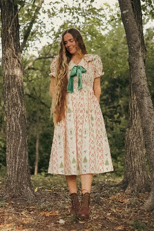 Maxi dresses with cut - out details on the sides for a modern edgeYuletide Dress