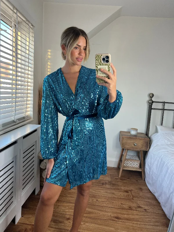 Mini dresses with mesh panels for a sexy and trendy lookDani Sequin Wrap Dress / Peacock Blue Mini dresses with mesh panels for a sexy and trendy lookDani Sequin Wrap Dress / Peacock Blue