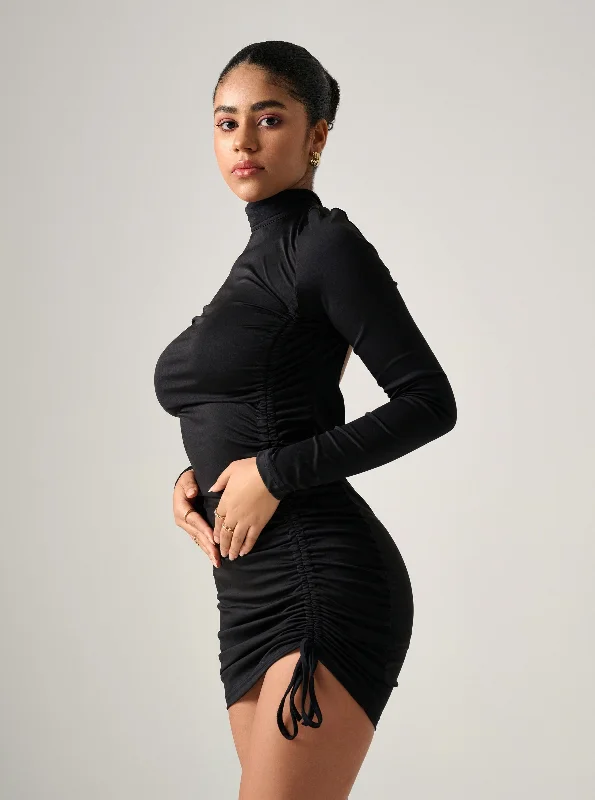 Mini dresses with mesh panels for a sexy and trendy lookKahili BLACK RUCHED DRESS