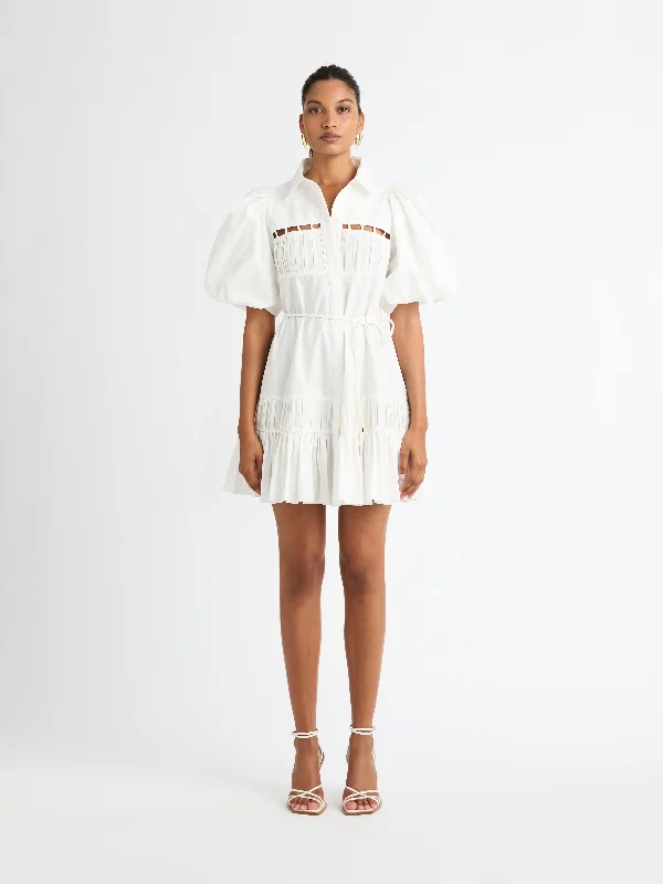 Mini dresses with asymmetric hems for a fashion - forward lookMA CHERIE MINI DRESS
