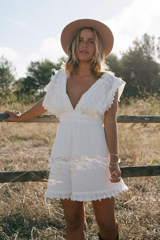 Mini dresses with tassel accents for a fun touchMamacita Dress White
