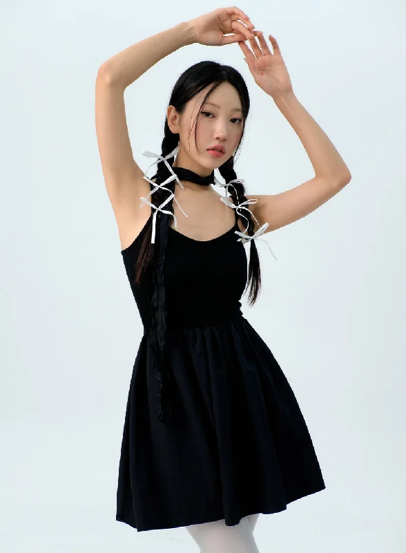 Mini dresses with tiered skirts for added volumeMini Camisole Dress IG313
