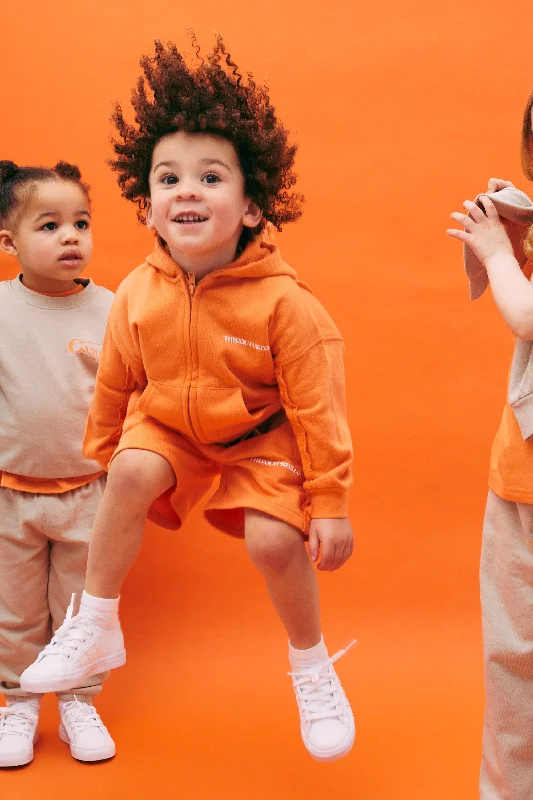 Ruffled Hem Women Shorts to Add a Feminine TouchKIDS RAW SEAM SHORTS - ORANGE