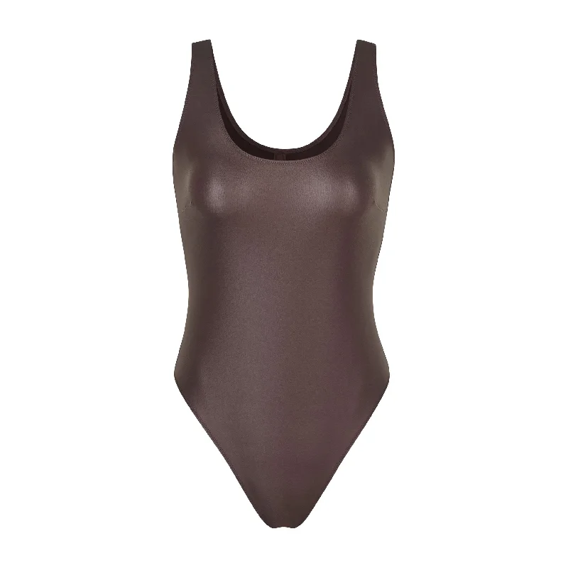 Ruffled Bodysuits with a Playful and Feminine TouchWET JERSEY TANK BODYSUIT | COCOA